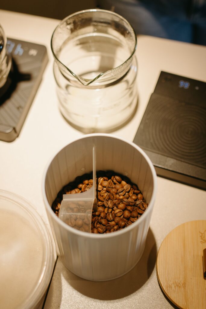 Coffee beans stored in a container on a kitchen counter