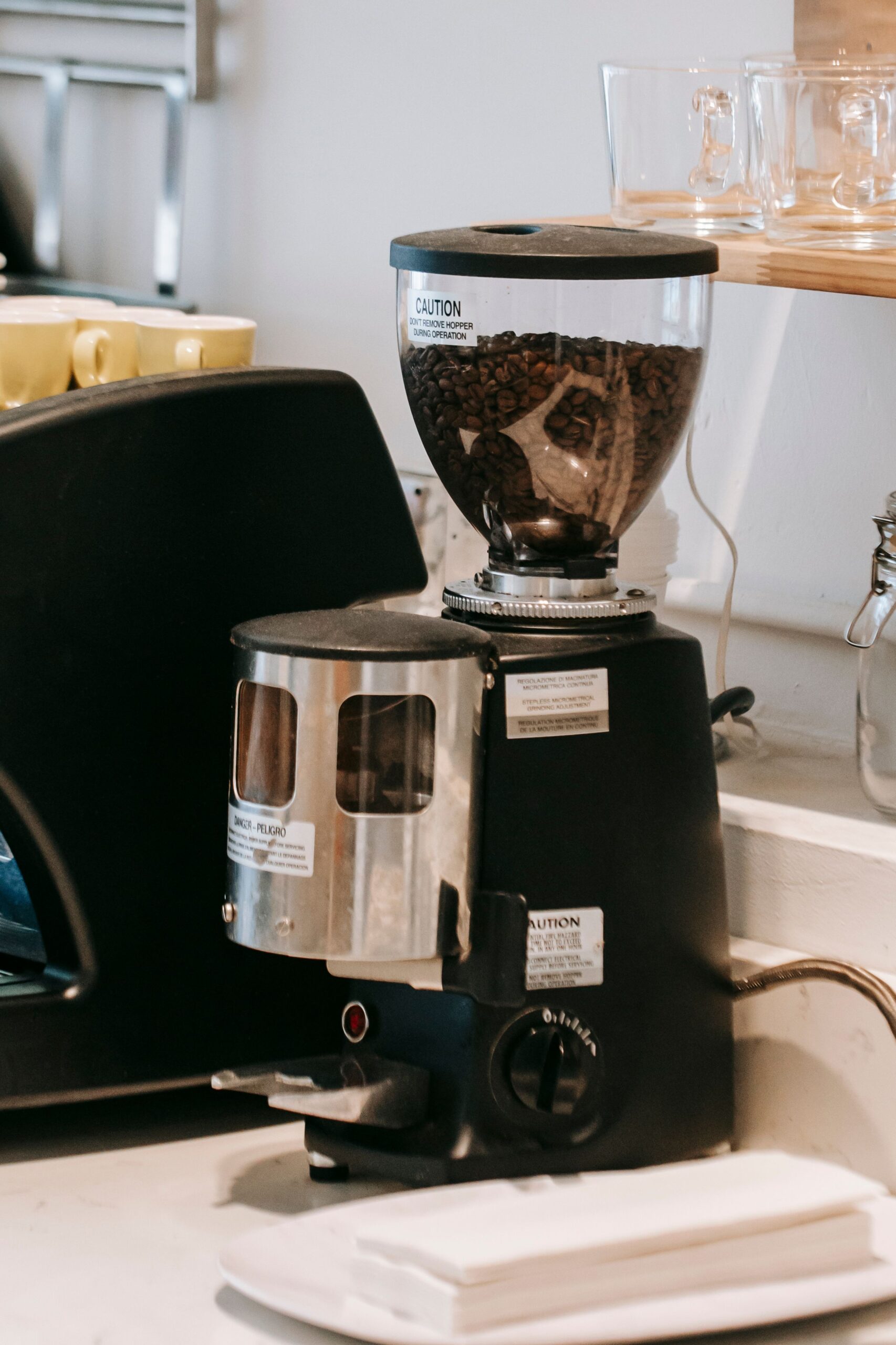 Modern coffee grinder on a kitchen counter