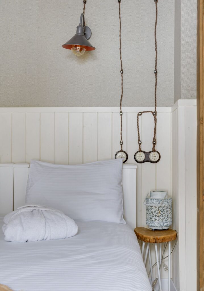 White pillow on a neatly arranged bed