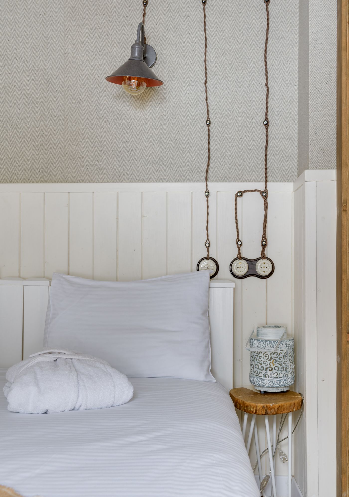 White pillow on a neatly arranged bed