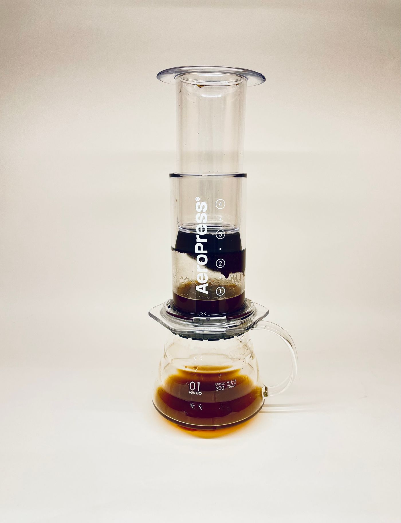 AeroPress coffee maker above a glass serving vessel