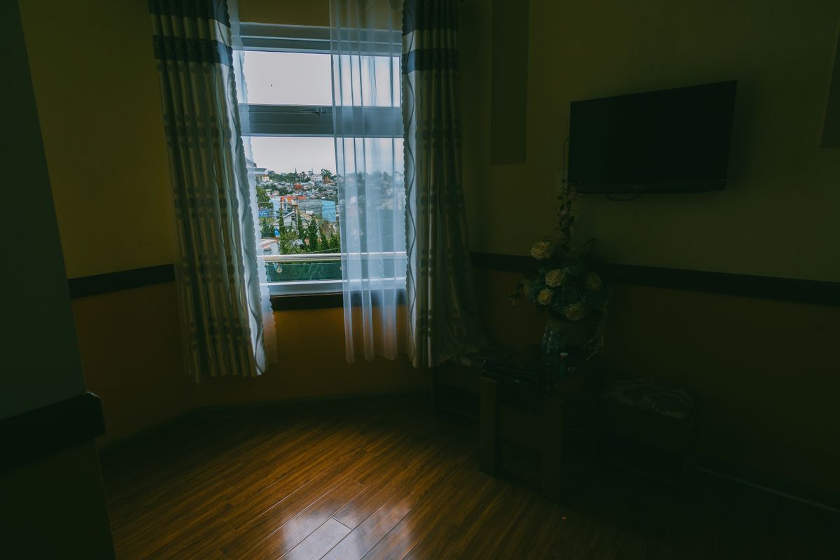 Living room window with curtains and outdoor view