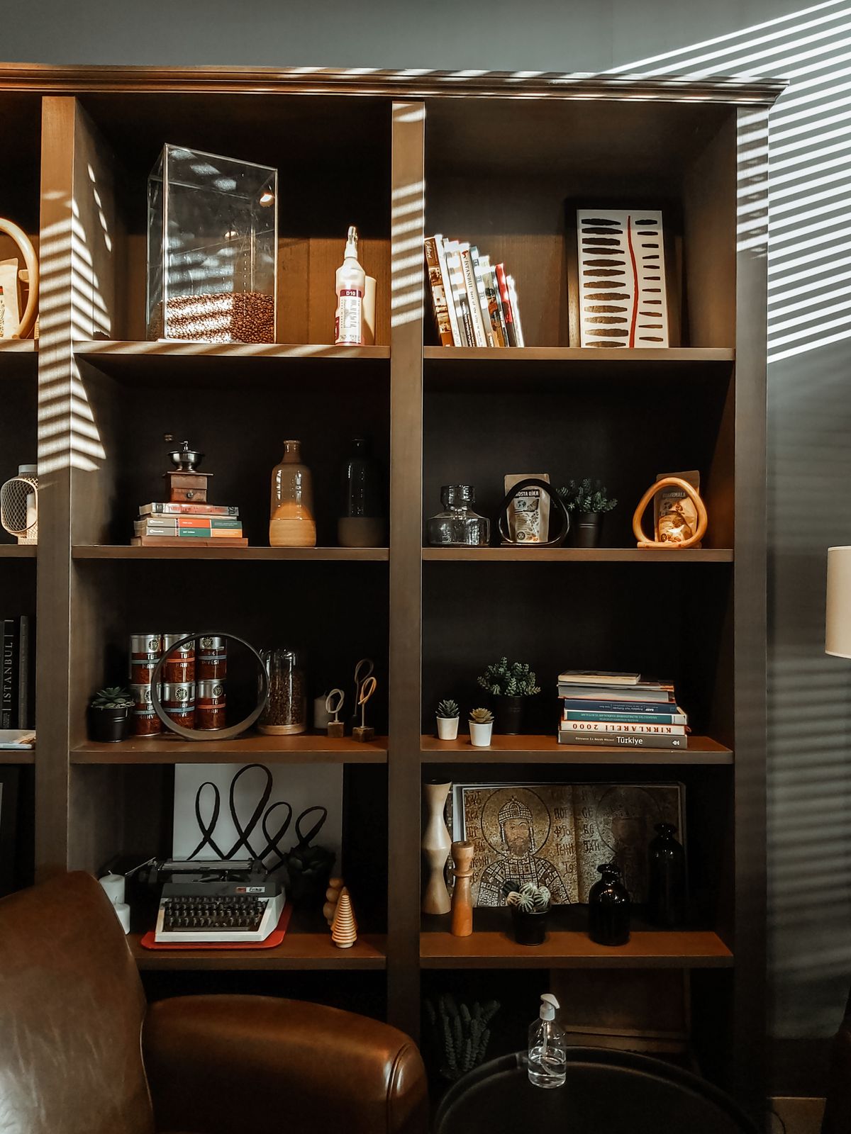 Bookcase with books and decorative objects in a room