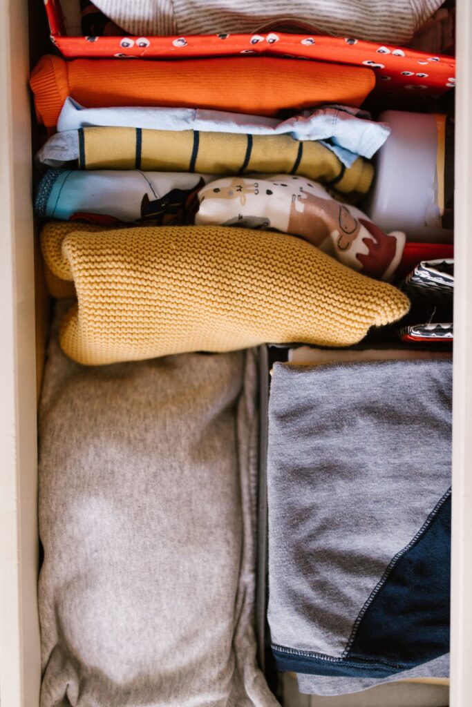 Folded clothing arranged in a drawer