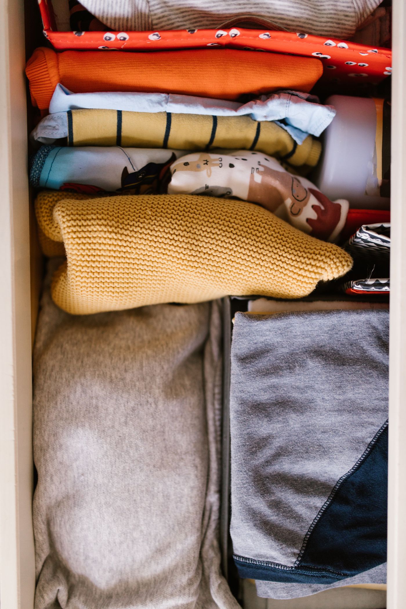 Folded clothing arranged in a drawer