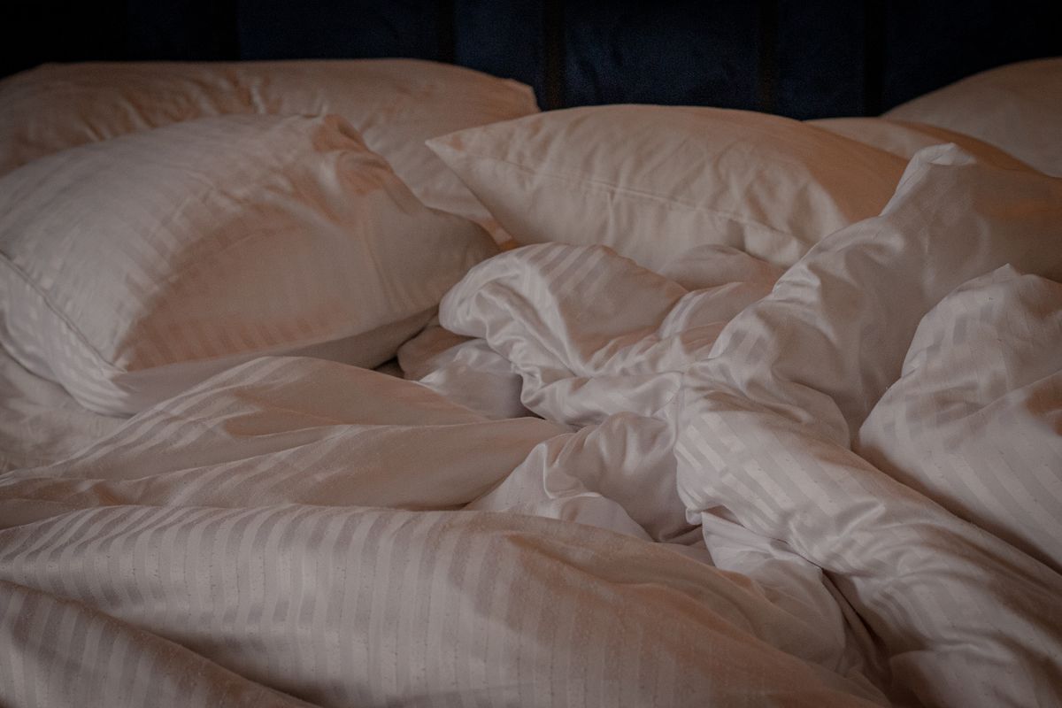 White bedding and pillows on a bed