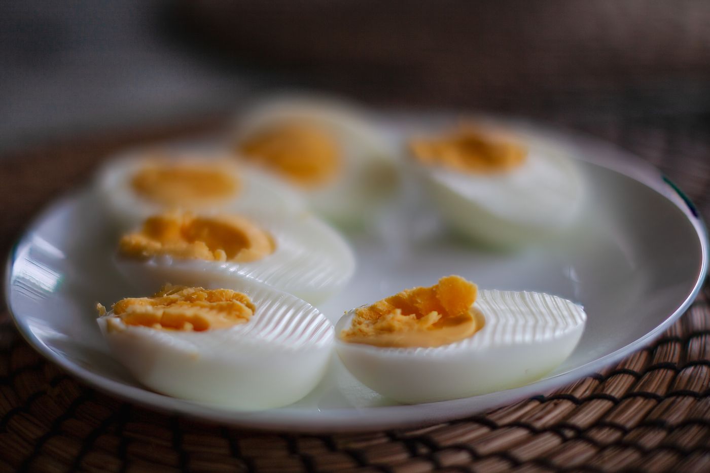 Sliced boiled eggs on a white plate