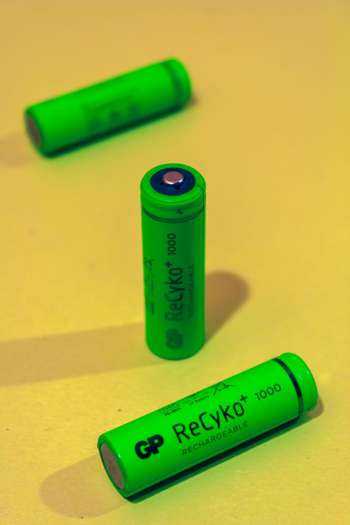 Green cylindrical batteries in a close view