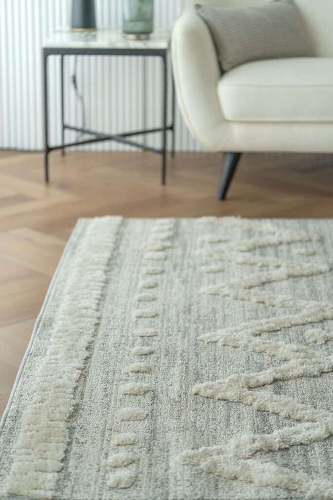 Living room with an area rug on wood flooring