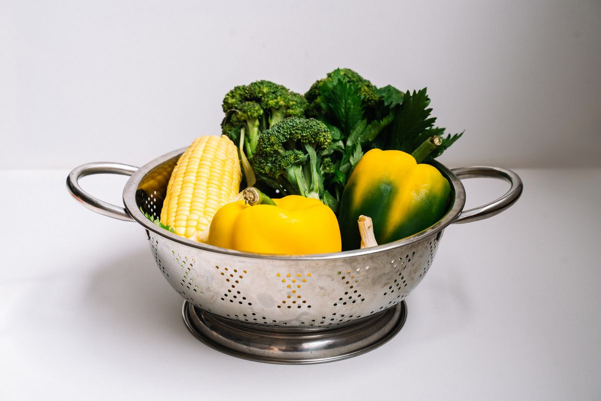 Vegetables in a stainless steel colander