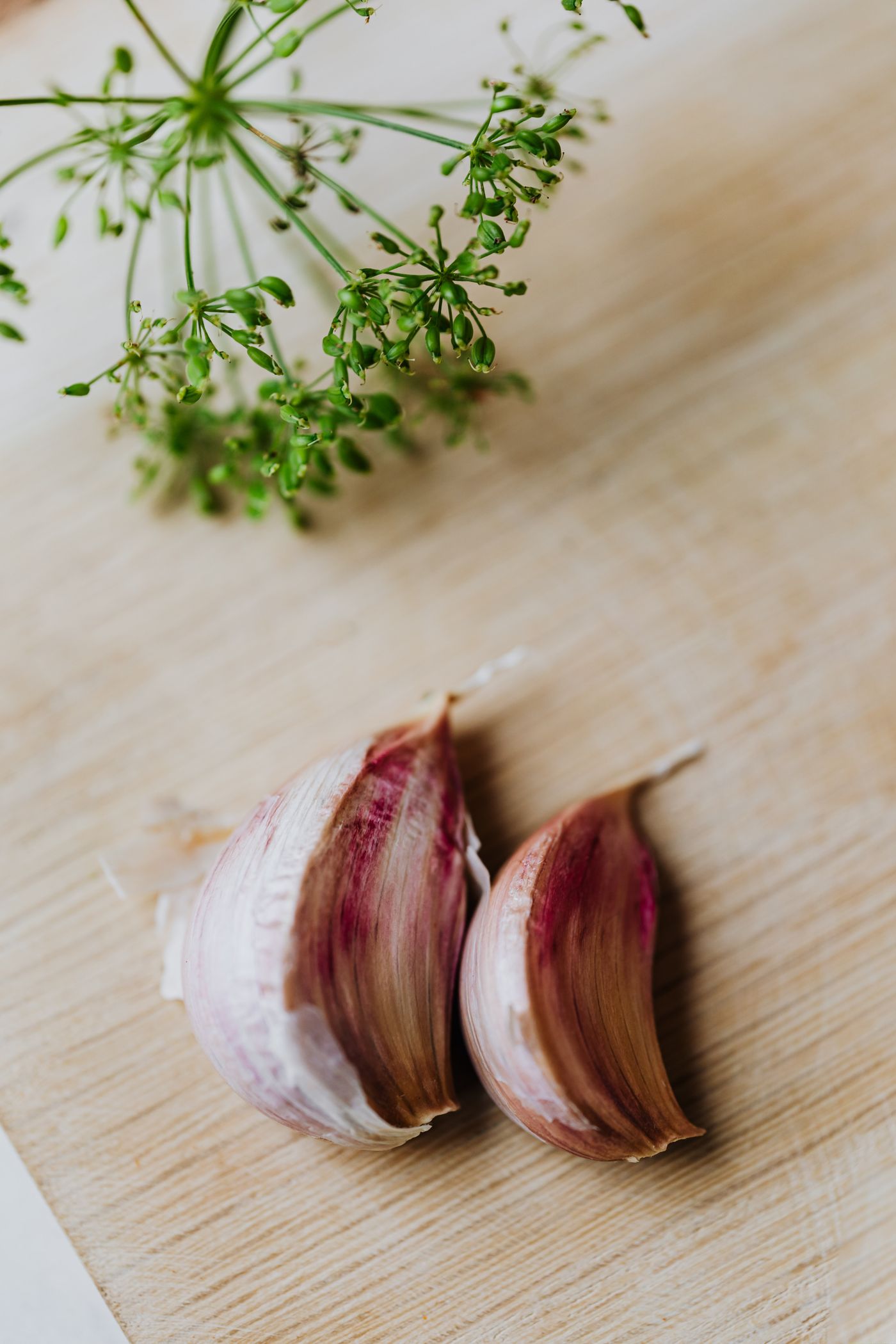 Garlic cloves on a wooden cutting board