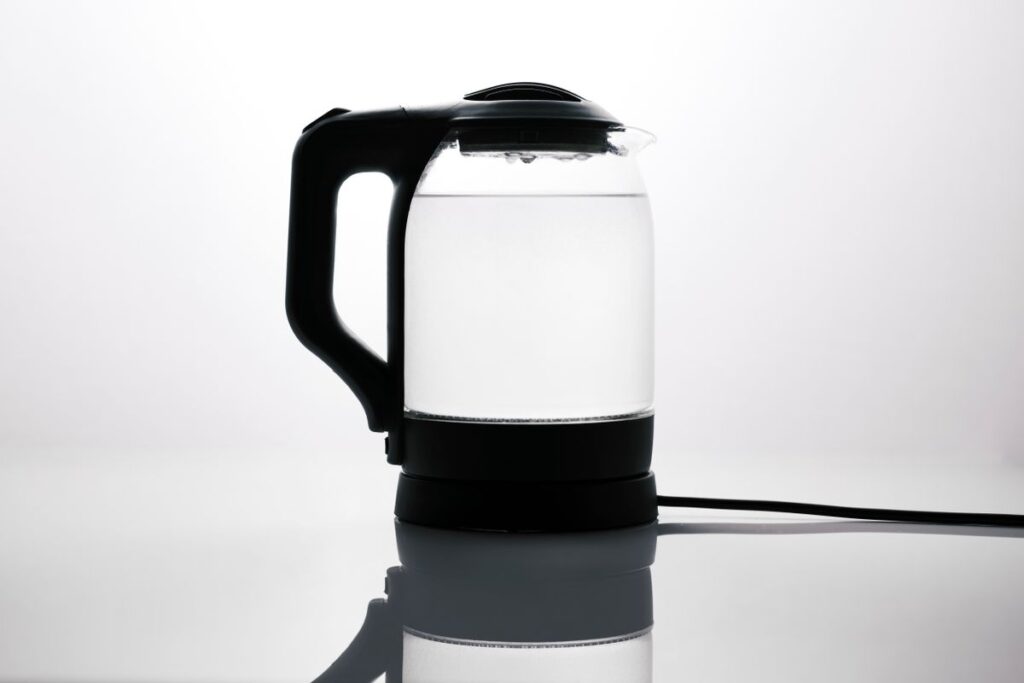 Glass electric kettle containing water
