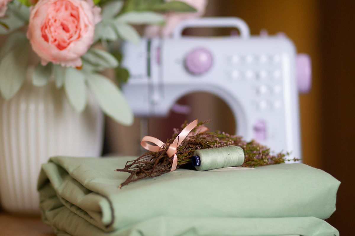 Sewing machine and fabric with flowers on a table