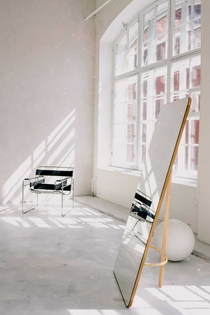 Full-length mirror in a bright room