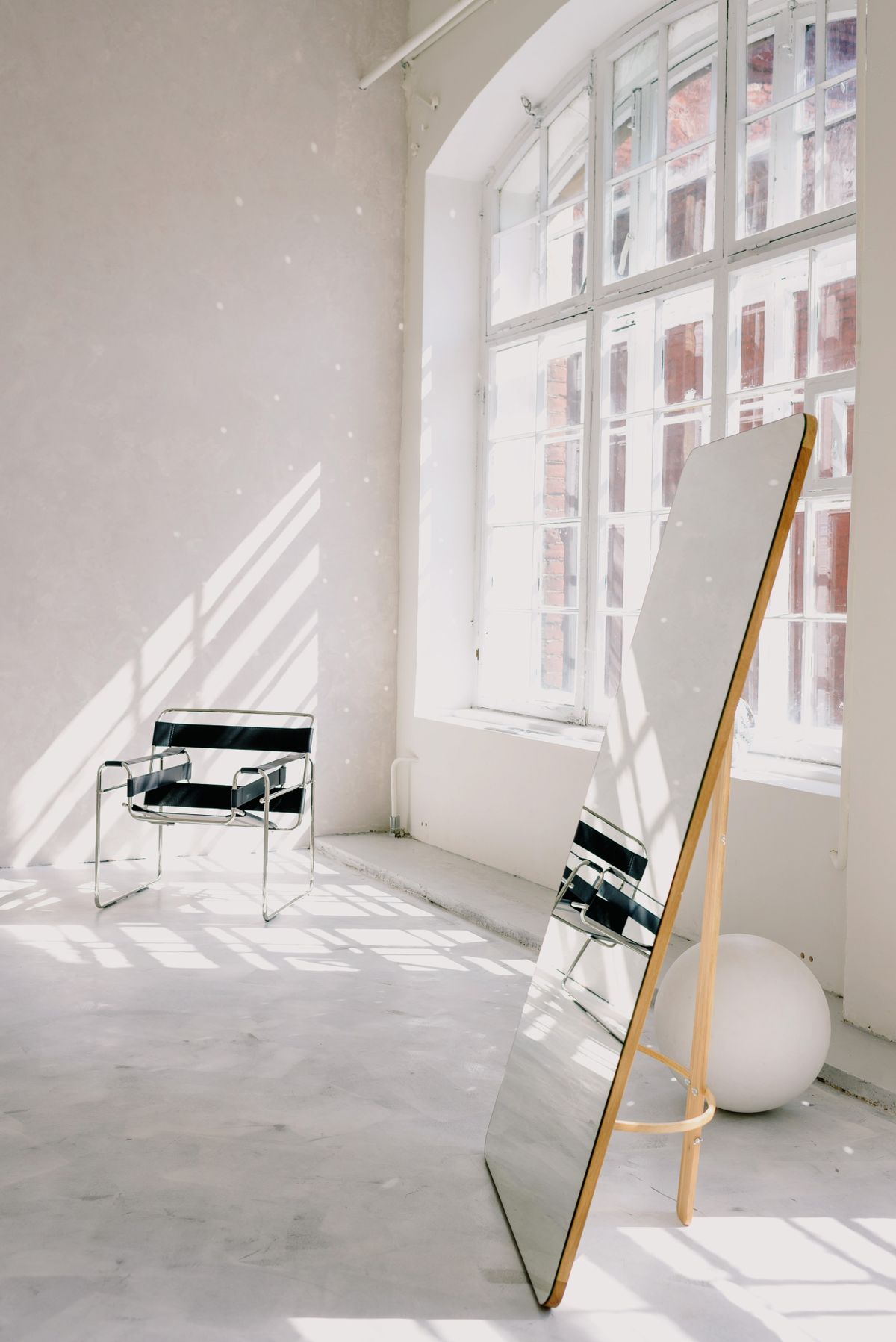 Full-length mirror in a bright room