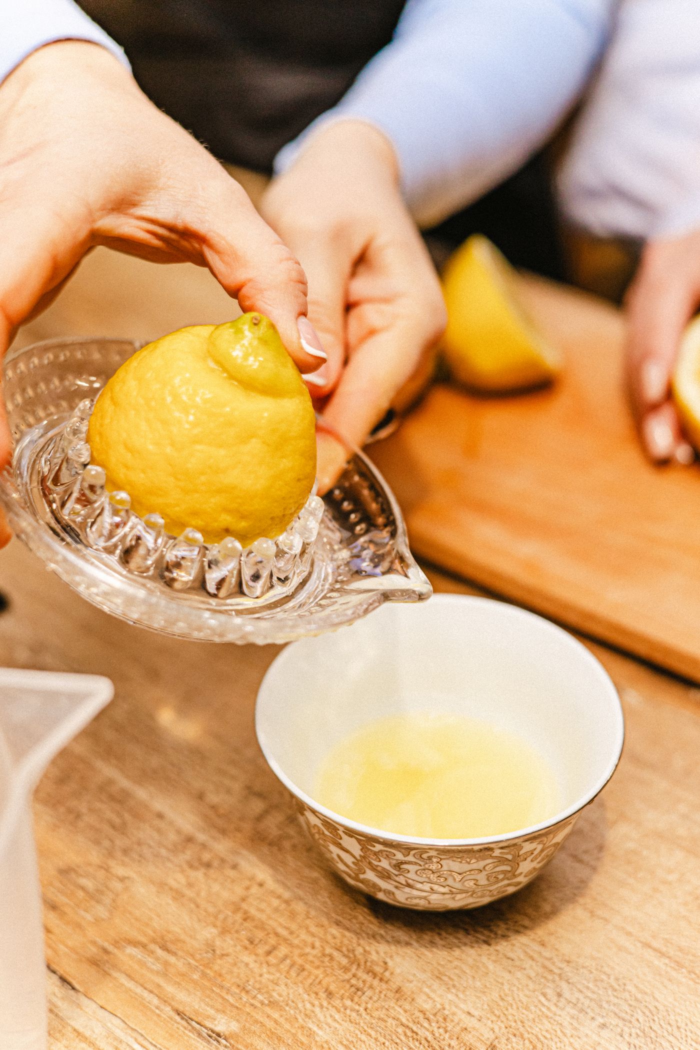 Lemon juice being squeezed during kitchen preparation
