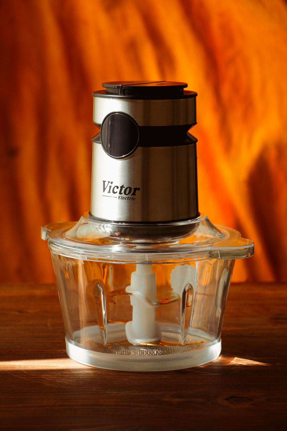 Compact food processor on a wooden surface