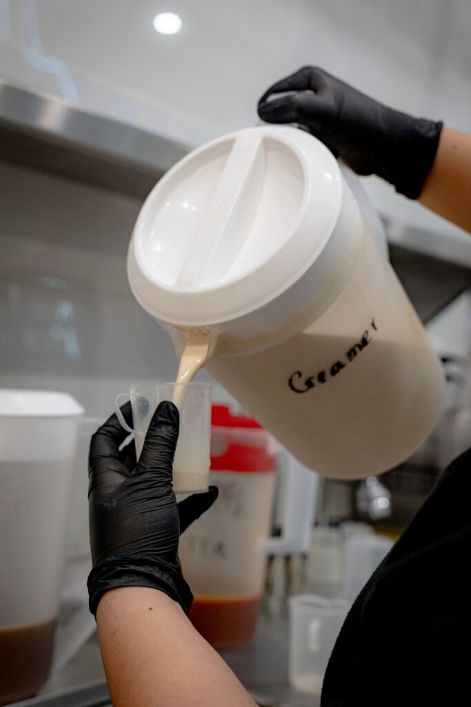 Liquid being poured into a measuring cup