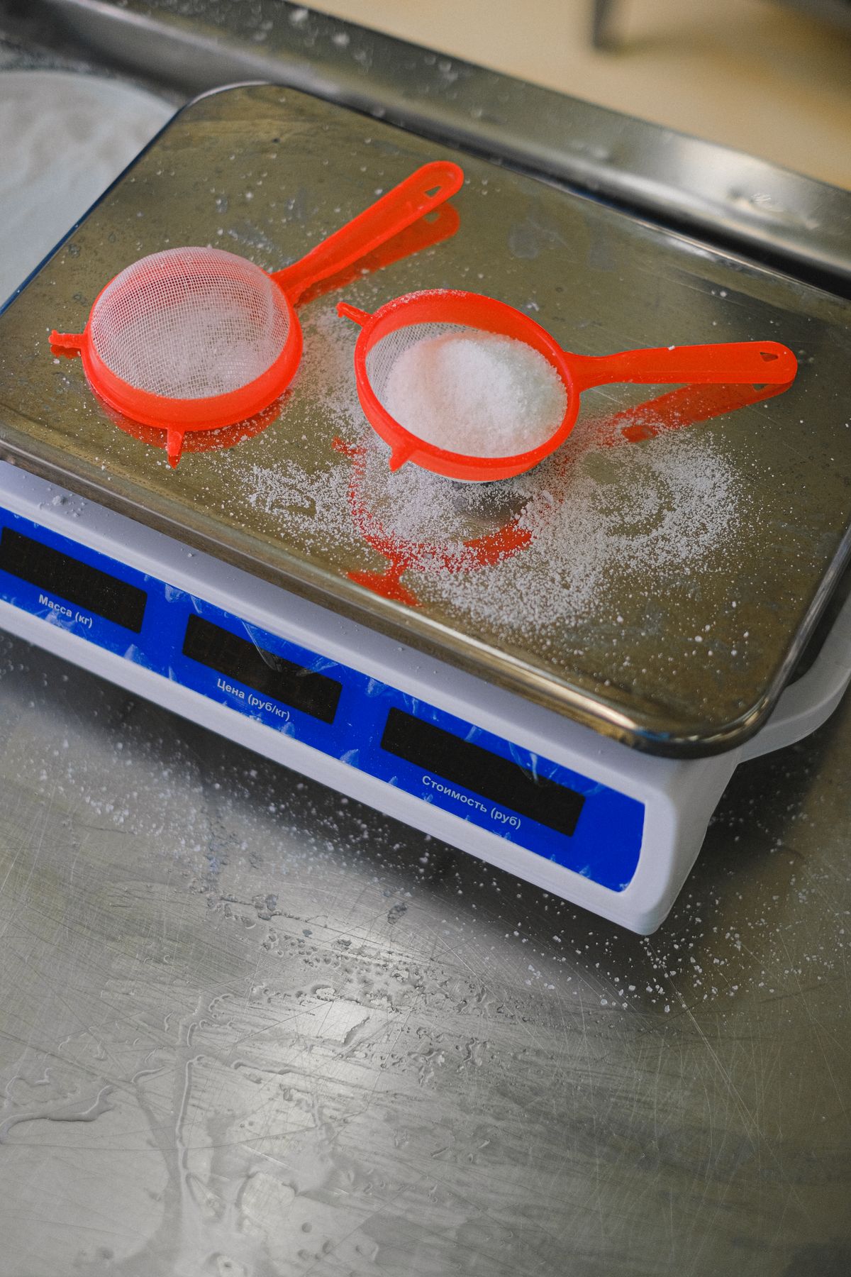Flour and sieves placed on a digital kitchen scale