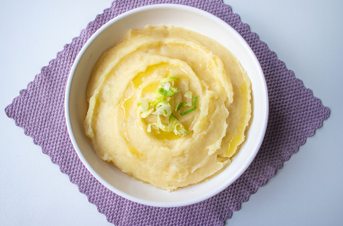 Mashed potatoes served in a white bowl