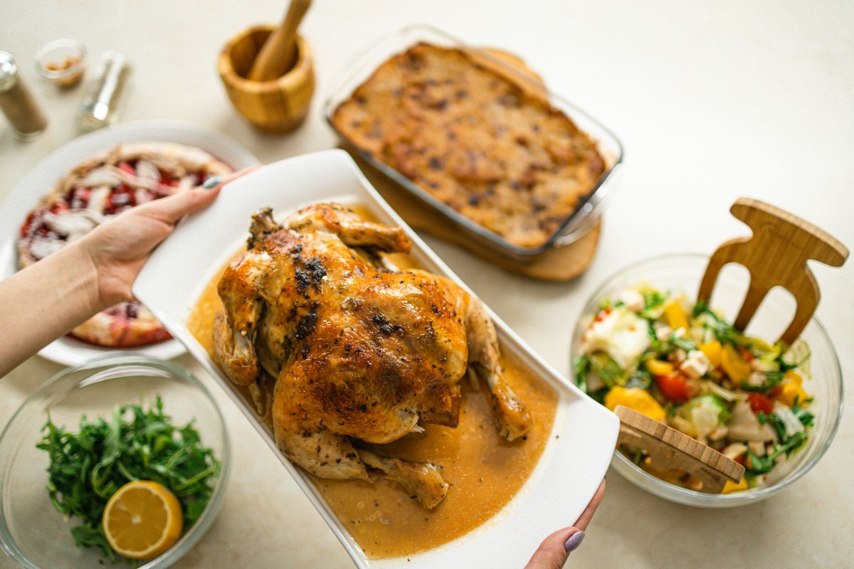 Roasted chicken served with salad and side dishes
