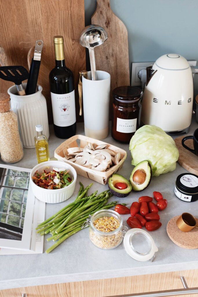 Fresh vegetables and kitchen tools arranged on a countertop