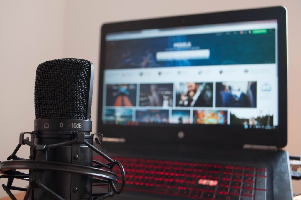 Microphone beside a laptop on a desk