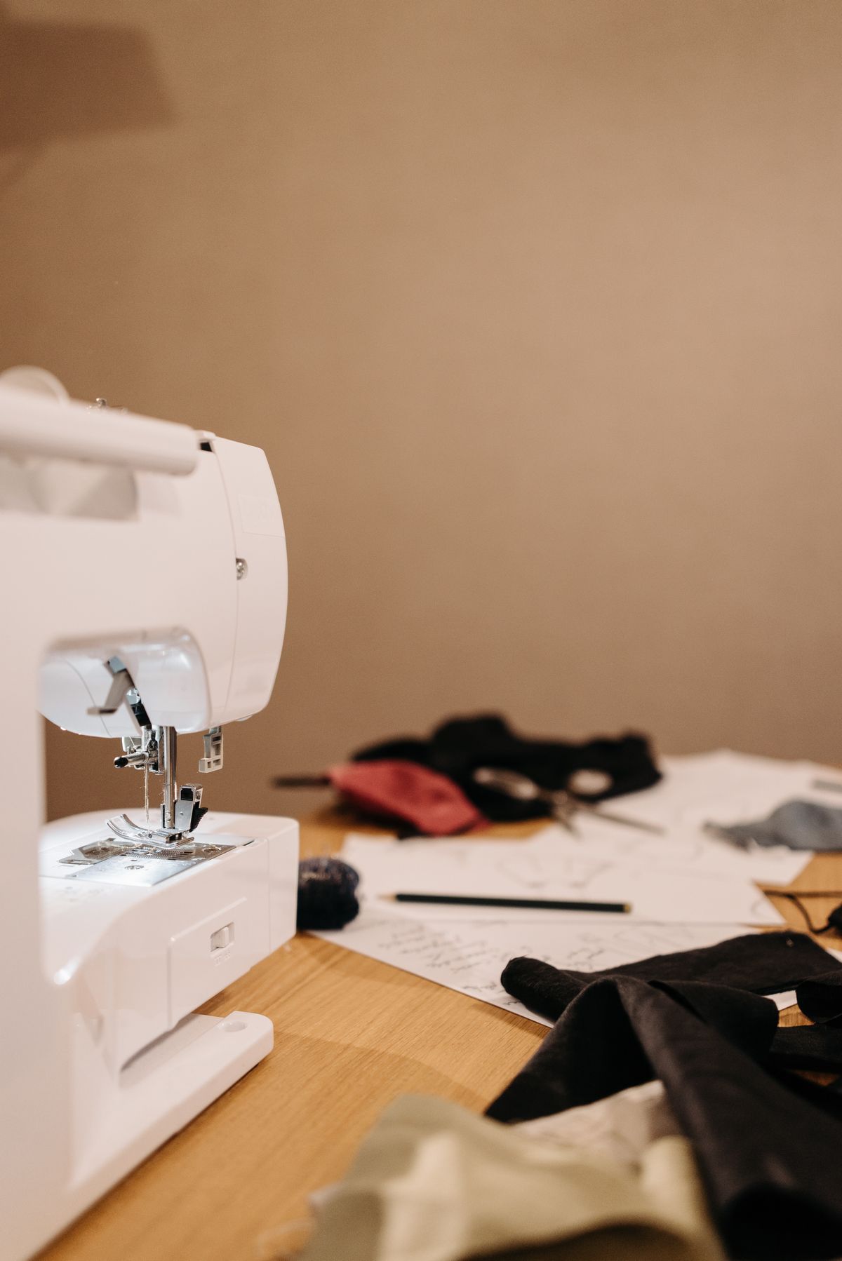 Sewing machine, fabric and tools on a work table