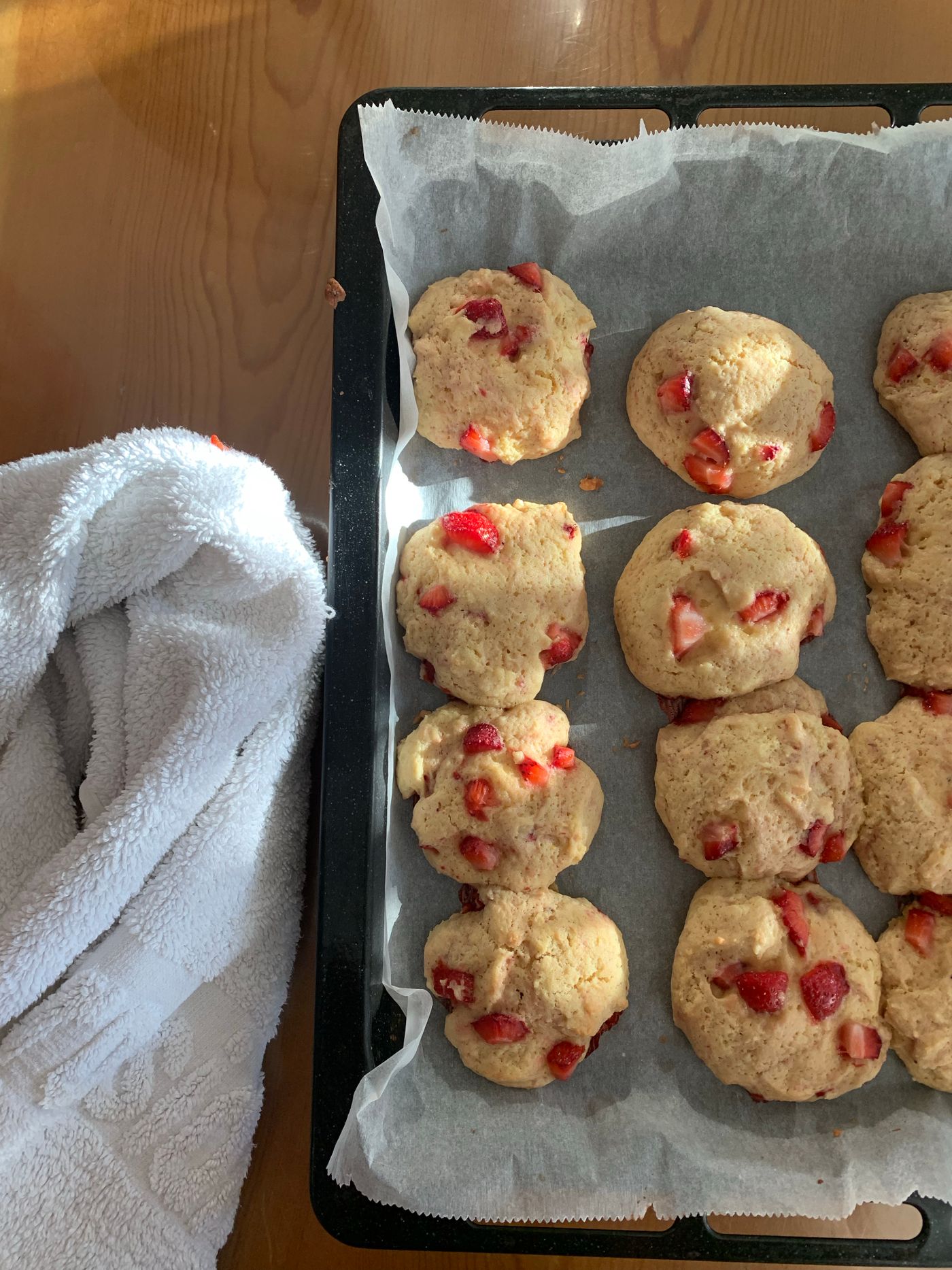 Cookies on baking paper on a tray