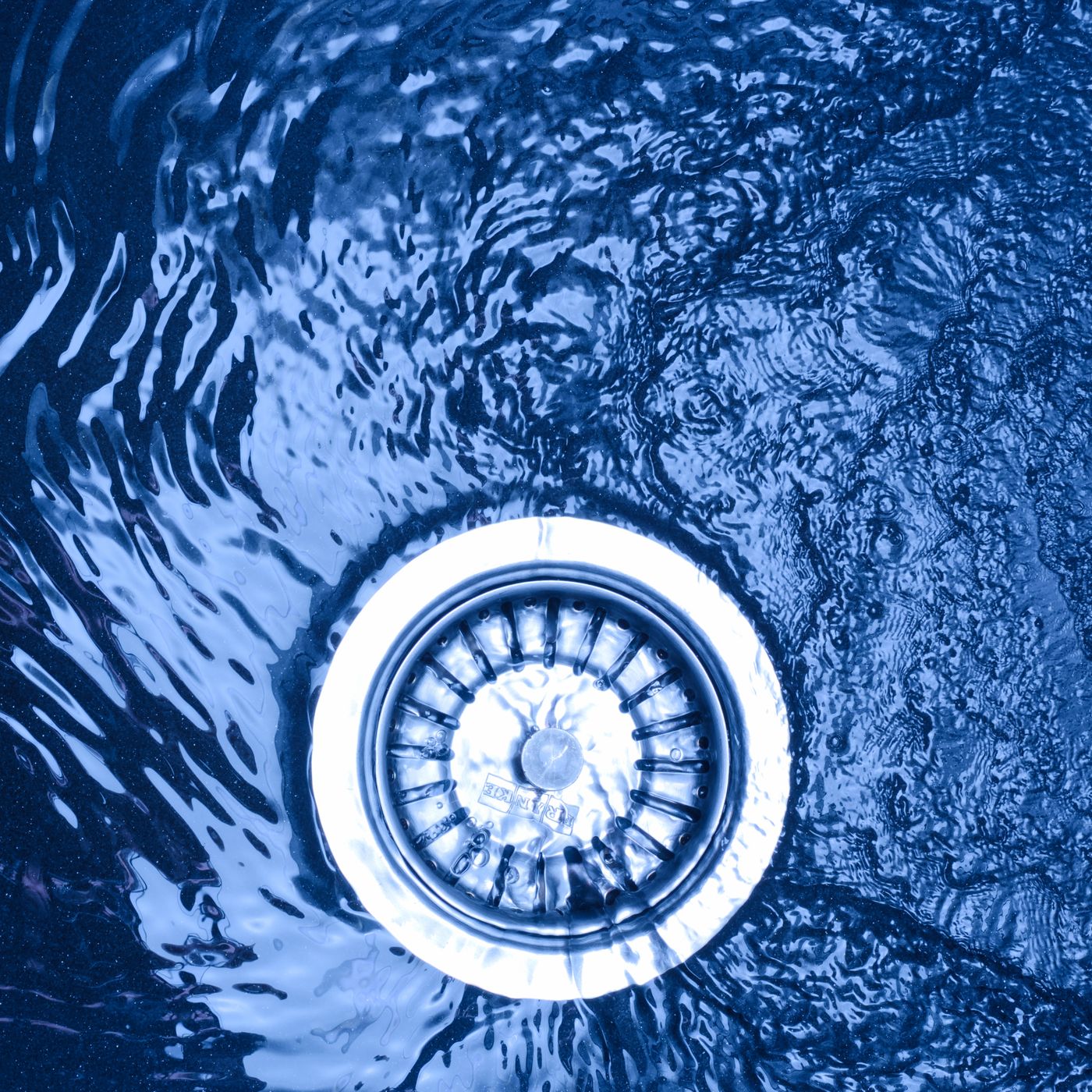 Water near a metal sink drain strainer
