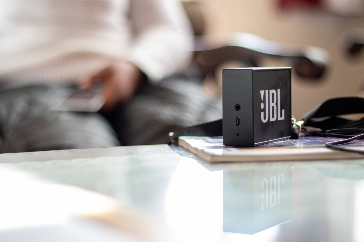 JBL speaker on a reflective table