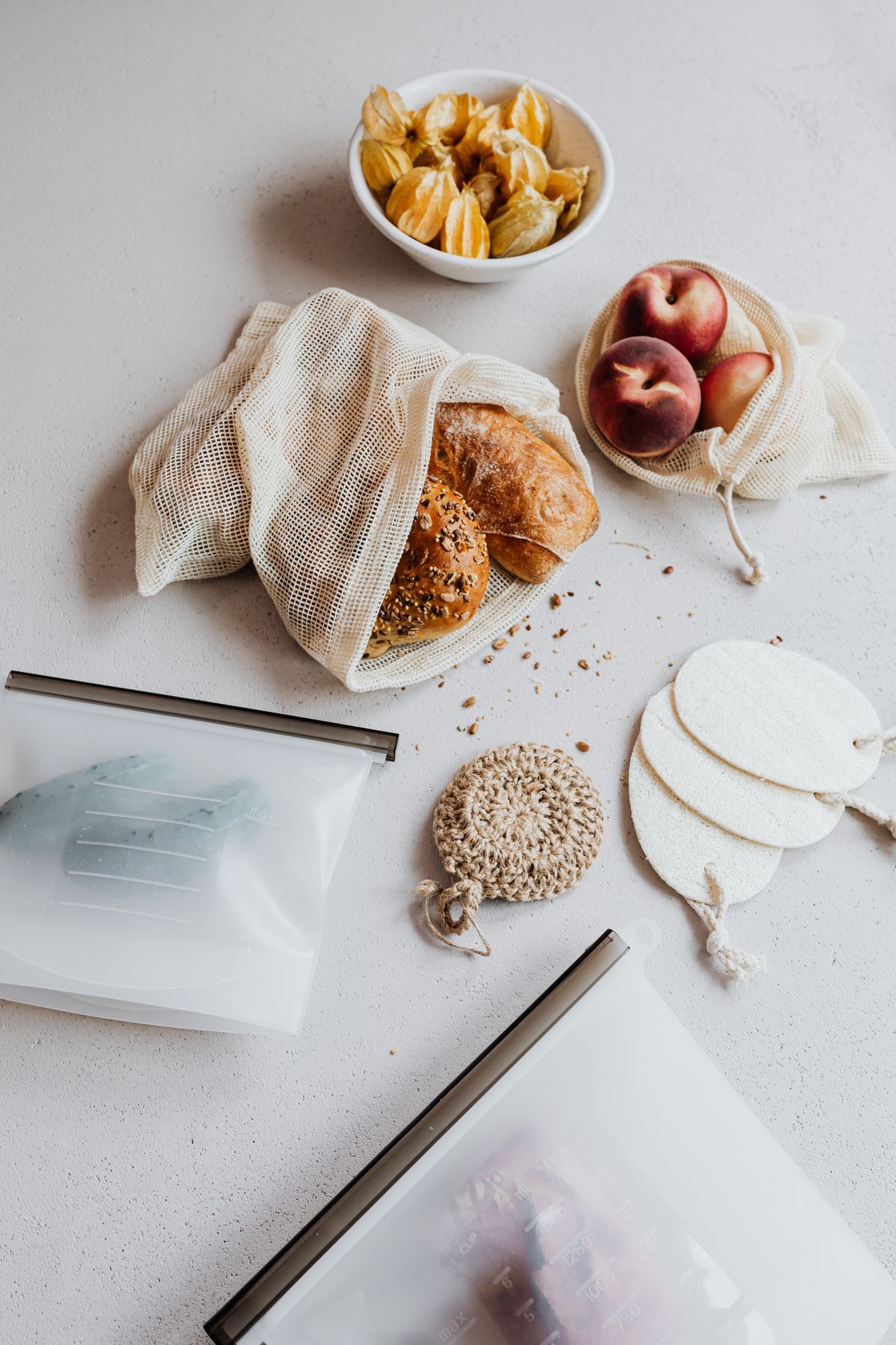 Reusable food bags with bread and fruit