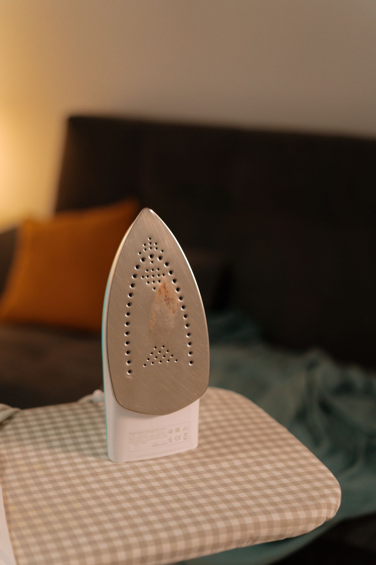 Clothes iron on an ironing board