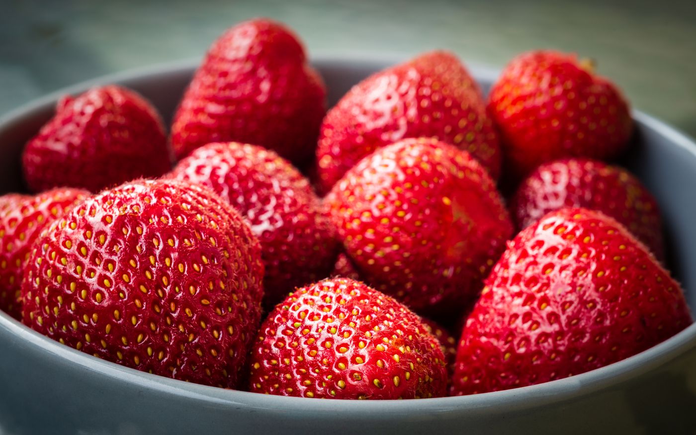Ripe strawberries gathered in a bowl
