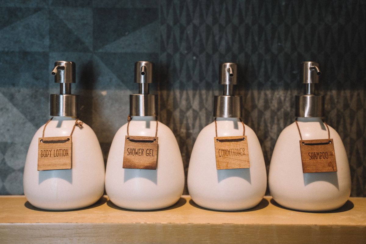 Pump bottles arranged with bathroom essentials