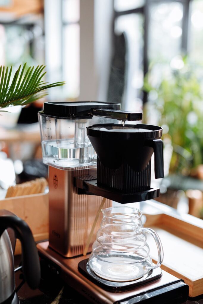Coffee brewer with a glass carafe on a table